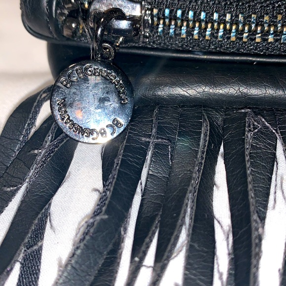 BCBGeneration black clutch bag. Snaps closed hanging leather strings. 2 zippers - Picture 5 of 9